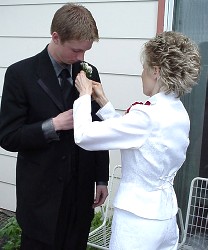 That's his mother. She bought the corsage too!